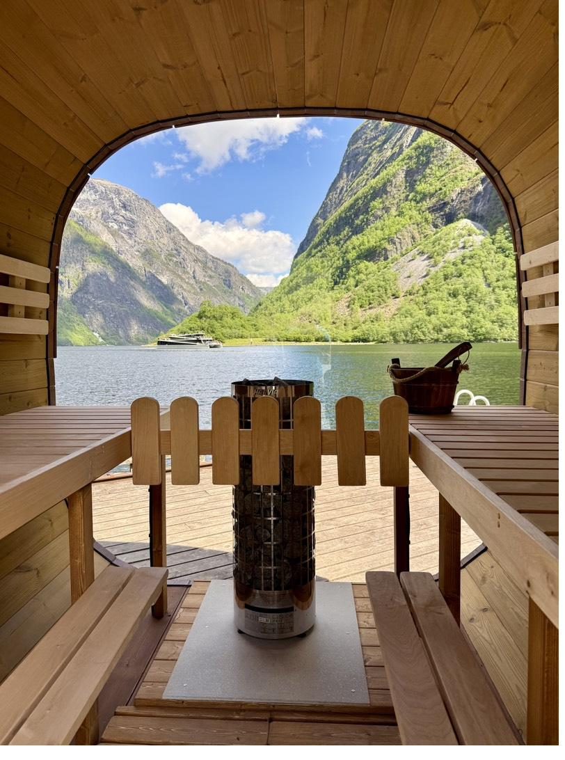 Inside Bakka Sauna: wooden benches and a window filled with the Nærøyfjord